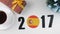 Illustration, new year, male hand changes the year from 2017 to 2018, Spain flag, cauntry ball.