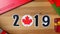 Illustration, new year, male hand put on the table on Canadian flag, country ball, 2019