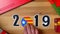 Illustration, new year, male hand put on the table on Catalonian flag, country ball, 2019.