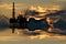 Illustration of oil platform on sea and sunset