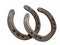 Illustration of a pair of rusty horseshoes