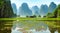 Illustration of a remote view of a boat floating in the river. south china high mountain background. Generative AI