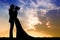 Illustration of spouses kissing at sunset
