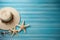 Illustration for summer vacation of a Hat, glasses, and starfish on a blue wooden background, in the style of serene seascapes.