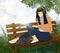 Illustration teenager sitting on the bench with sleeping cat  and listening to music from head phone, Digital paint a girl