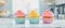 illustration of three cupcakes with colorful frosting on marble countertop in a kitchen