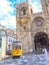 Illustration of vintage tram in lisbon district names Alfama at Cathedral Se