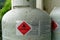 Illustrative editorial: Flammable gas warning symbol and information panel on a LPG gas cylinder