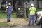 Illustrative editorial of two linemen working on a power transformer