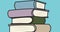 Illustrative image of books stacked against blue background, copy space