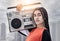 Im about that boombox life. Cropped portrait of an attractive young female dancer standing with her boombox on a rooftop