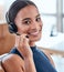 Im always happy to help. Shot of a beautiful young woman working in a call center.