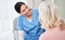 Im so happy that youre feeling better. a female nurse smiling while talking to her patient.