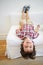 Im ok with my crazy. an adorable little boy playfully hanging upside down on the edge of the sofa.