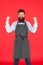 Im a winner. Bearded man celebrating victory or success. Brutal man in elegant apron with happy winning gesture. Cook