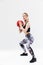 Image of active blond woman 20s dressed in sportswear working out and doing exercises with fitness ball