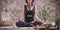 Image of an adult woman in yoga place. Meditation. The concept of yoga and spiritual practices