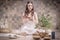 Image of an adult woman in yoga place. Playing on Tibetan singing bowls. The concept of yoga and spiritual practices