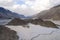 Image aerial view of the vast white sand and the mountain behind at Yarab Tso Lake Nubra Valley