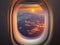 image of the aeroplane window viewing the beautiful outside aerial landscape.