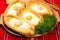 An image of an Ajarian khachapuri on table with raw egg close up