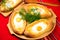 An image of an Ajarian khachapuri on table with raw egg close up