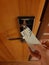 Image of analog punchcard as a key to open hotel room door