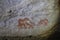 Image of ancient animals on the wall of the ocher cave. historical art. archeology