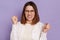 Image of angry aggressive dark haired woman wearing white shirt, clenched fists and teeth, having problems, frowning face, posing