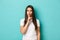 Image of angry brunette woman, wearing white casual t-shirt, shushing and scolding loud noisy person, standing over blue