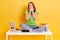 Image of astonished teenage girl screaming while studying with exercise books, lap top, pens, coffee. Surprised student sitting at