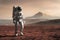 Image Astronaut explores Mars in space mission, walking on red planet
