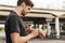 Image of athletic young sportsman using smartwatch while working out