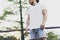 Image Bearded Muscular Man Wearing White Blank t-shirt, snapback cap and shorts in summer vacation.Relaxing time after