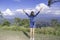 The image behind the women raise their arms looked at the mountains and cloud at Doi Samer Dao , Nan in Thailand