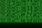 An image of a binary code made up of a set of green digits on a black background