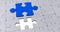 Image of blue piece of puzzle over multiple gray puzzle