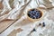 Image of blueberries in wooden bowl on rustic village table