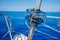 Image of the bow of a cruising sailing ship with roller furling gear.