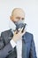 Image of business man wearing protective mask against virus and pollution