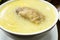 Image of `caldo de gallina` or chicken soup from Peru