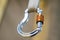 Image of a carabiner hook with climbing rope