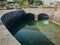 Image of castle moat filled with water on tropical island at ocean