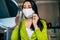 Image of Caucasian woman blogger wearing mask during quarantine, creating new content for her blog on social networks. Female