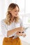 Image of charming elegant secretary woman holding clipboard in office