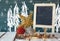 Image of christmas decorations and chalkboard next to blackboard background with winter concept drawings