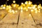 Image of christmas out of focus fairy lights and copy space on wooden background