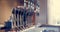 Image of close up of taps of beer and interior of traditional bar