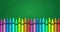 Image of colorful crayons against green background