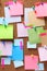 Image of colorful sticky notes on cork bulletin board